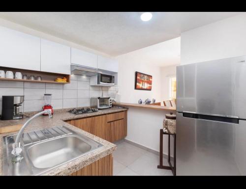 Casa Comoda Con Piscinaにあるキッチンまたは簡易キッチン