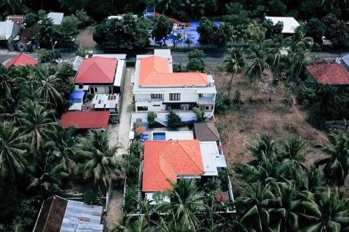 an aerial view of a house with orange roofs at Dani Private Villa - 2BR Private Pool Villa in Tejakula North Bali in Gretek