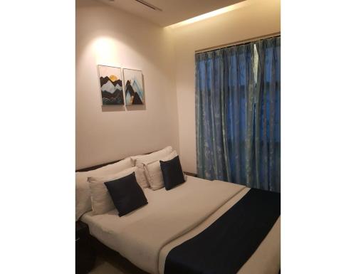 Katil atau katil-katil dalam bilik di Hotel White Tree, Chandigarh