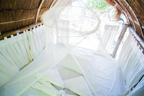 Ein Bett oder Betten in einem Zimmer der Unterkunft Playa La Caleta Bataan