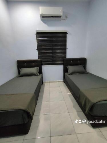 Ένα ή περισσότερα κρεβάτια σε δωμάτιο στο Homestay HABI Residence