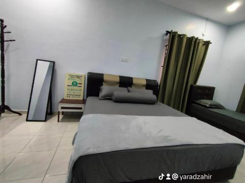 Ένα ή περισσότερα κρεβάτια σε δωμάτιο στο Homestay HABI Residence