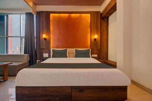 En eller flere senge i et værelse på Aravali Inn