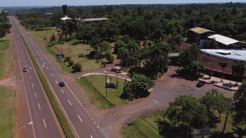 an aerial view of a road next to a building at HOTEL TROPICAL IGUAZU in Puerto Iguazú