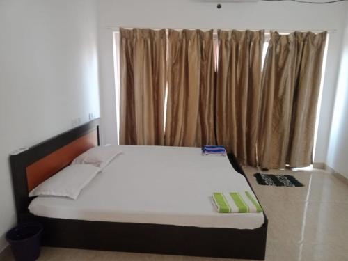 Ένα ή περισσότερα κρεβάτια σε δωμάτιο στο Suman beach House