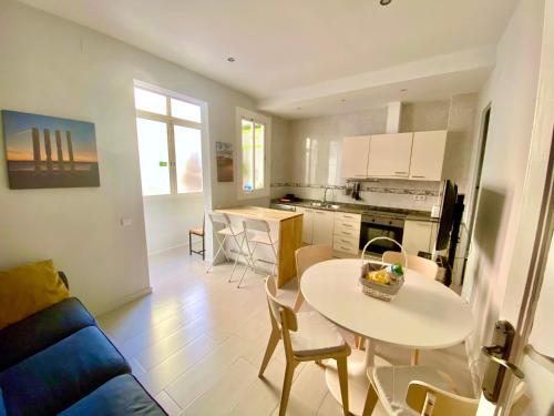 a kitchen and a living room with a table and chairs at Barcelona Family Beach in Barcelona