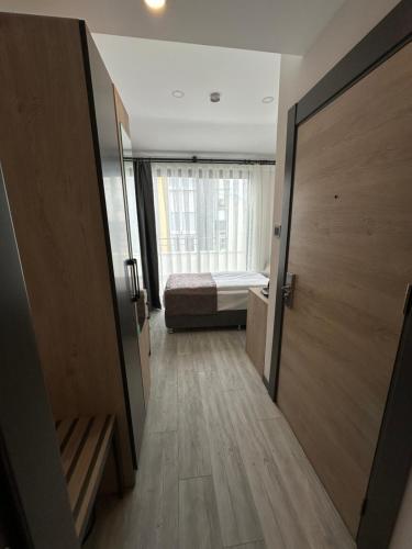 a room with a bedroom with a bed and a door at IRENIC HOTEL in Antalya