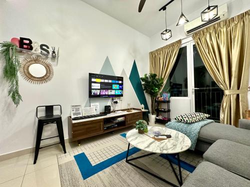 a living room with a couch and a tv at Urban Gateway Homestay# Bangi#Wifi 300Mbps#Netflix in Kampong Tangkas