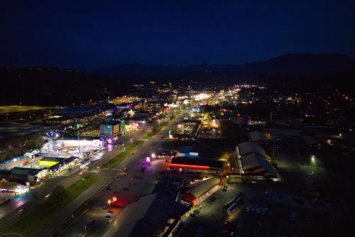 a view of a city at night with lights at Park Tower Inn in Pigeon Forge