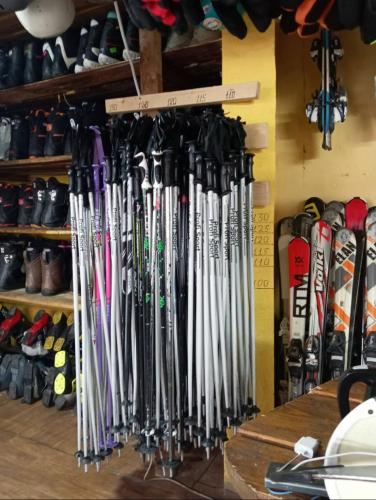 a bunch of baseball bats hanging on a wall at SPA Resort HeRICH in Bukovel