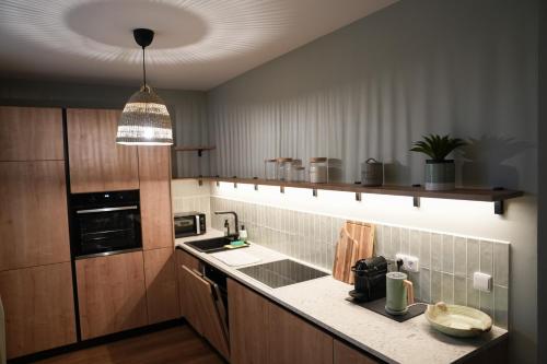a kitchen with a sink and a counter top at Stilvolle Stadtoase in Brno