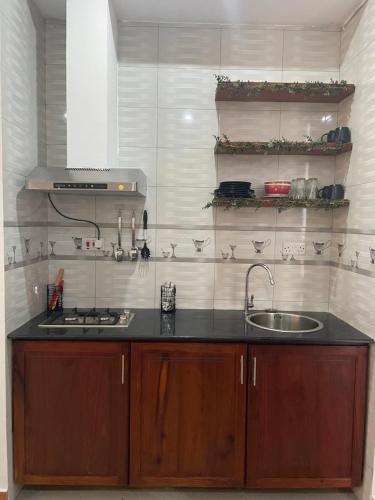 a kitchen with a sink and a counter top at Stylish 1-Bedroom Apartments with Amazing Views in Dar es Salaam