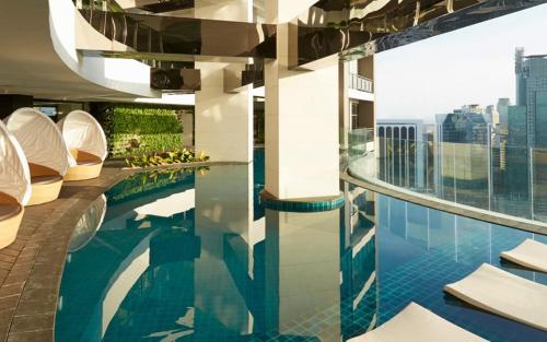 a swimming pool on top of a building at Luxury 2BR Penthouse in Gramercy, Makati in Manila