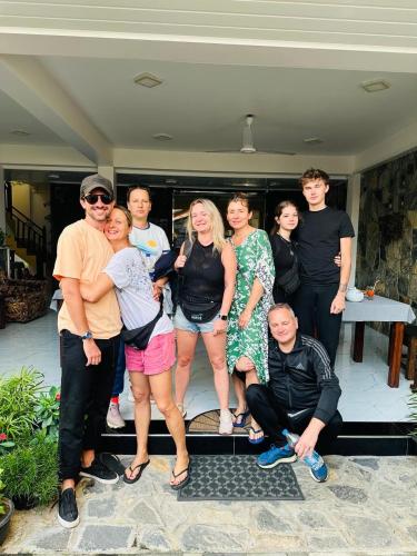 a group of people posing for a picture at Funwhales Rest House in Negombo
