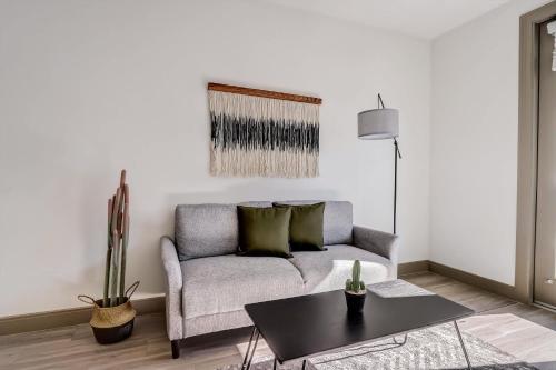 a living room with a couch and a table at Modern CozySuites on the Town Lake waterfront 16 in Tempe