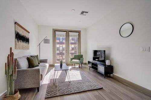 a living room with a couch and a chair at Modern CozySuites on the Town Lake waterfront 16 in Tempe