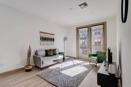 a living room with a couch and a table at Modern CozySuites on the Town Lake waterfront 16 in Tempe