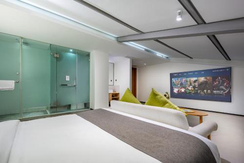 Ένα ή περισσότερα κρεβάτια σε δωμάτιο στο Trip Voicer Chengdu Wide and Narrow Alley