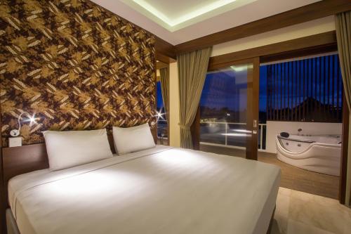 Ένα ή περισσότερα κρεβάτια σε δωμάτιο στο M Suite Bali