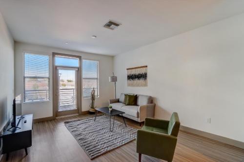 a living room with a couch and a table at Modern CozySuites on the Town Lake waterfront 17 in Tempe