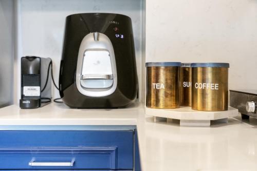 a black and gold appliance sitting on top of a counter at pisgat shoresh in Shoresh