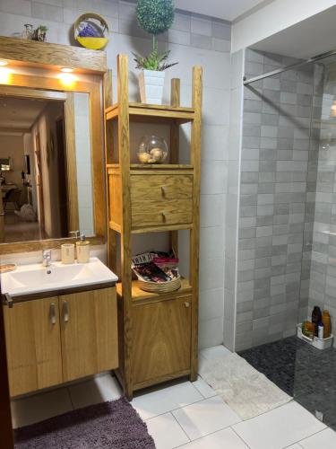 a bathroom with a sink and a shower at Hadil Room in Rabat