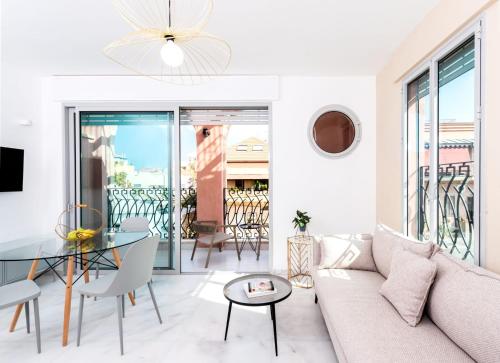 a living room with a couch and a glass table at Jaffa Port TLV Hotel Apartments יפו תל אביב in Tel Aviv