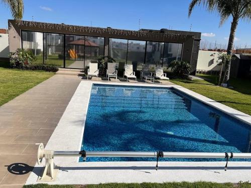 a swimming pool in front of a house at Workation Montpellier in Santa María Coronanco