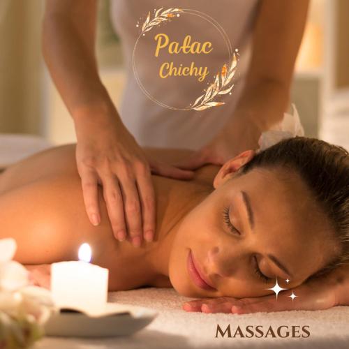 a woman getting a massage at a spa at Pałac Chichy in Małomice