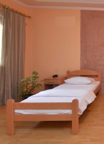 Ένα ή περισσότερα κρεβάτια σε δωμάτιο στο Guest house Vila Bor
