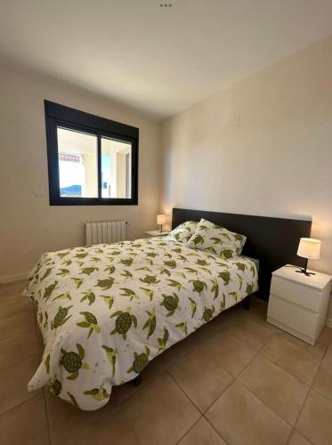 a bedroom with a bed and a window at Casa Cristina, Corvera in Corvera