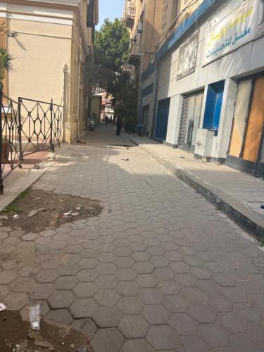 an empty street in a city with a building at زافيرو مسرح سيد درويش للعائلات فقط families only in Alexandria