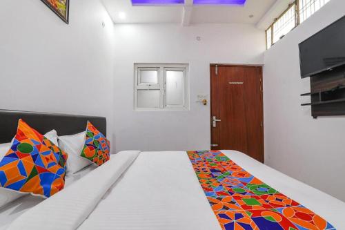 Ein Bett oder Betten in einem Zimmer der Unterkunft A One Prime Hotel