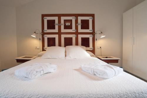 Postel nebo postele na pokoji v ubytování Hotel Hostal Chic
