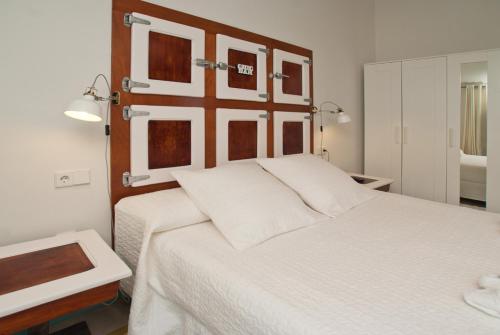 Postel nebo postele na pokoji v ubytování Hotel Hostal Chic