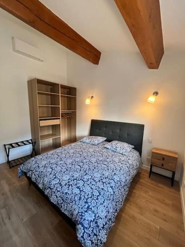a bedroom with a bed and a wooden floor at Villa Victoria #8 persons #3 Bedrooms #Terrace # garage Beach - Calm and Clim in Roquebrune-Cap-Martin