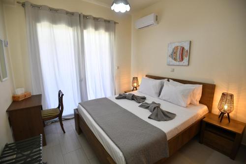 Katil atau katil-katil dalam bilik di Dionysus seaside villa
