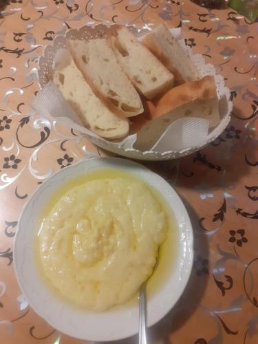 a plate of food with a bowl of hummus and bread at STD Cvetković in Crni Vrh