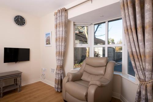 a living room with a chair and a window at 5 Bruach na hAbhann in Clonakilty