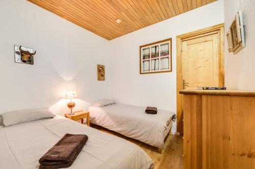 Ein Bett oder Betten in einem Zimmer der Unterkunft Grand Paradis