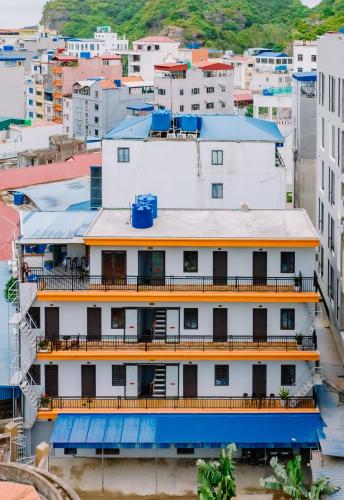 an overhead view of a city with buildings at Napoli Hostel Cat Ba in Cat Ba