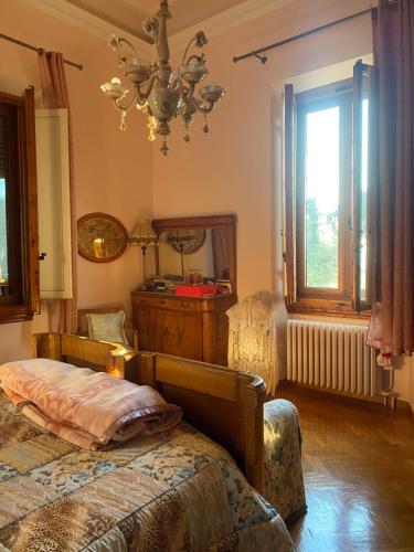 Un pat sau paturi într-o cameră la Villa La Cingallegra