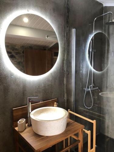 a bathroom with a sink and a mirror at Casa dos Veados in Ladeiras