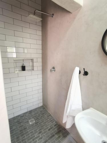 a bathroom with a sink and a white towel at Stay@Opstal in Pretoria