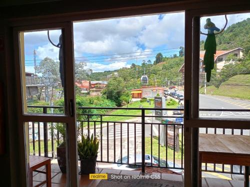 a view from a window with a view of a street at Pousada Miniférico in Campos do Jordão