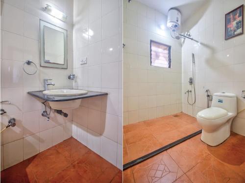a bathroom with a toilet and a sink at Hilltop 3BHK Villa With Private Pool Near Candolim in Candolim