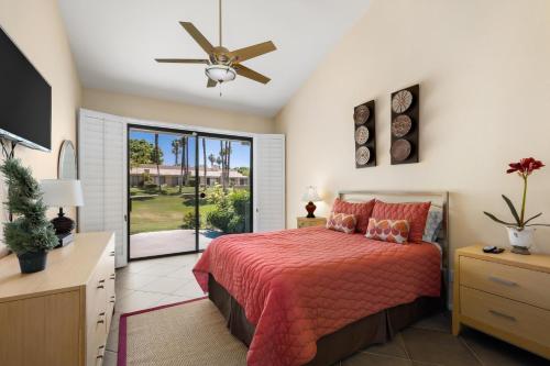 a bedroom with a bed and a ceiling fan at Palm Desert Oasis - With Beatiful Golf Courses in Palm Desert