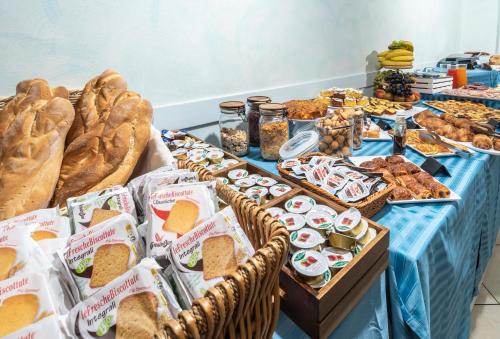 a table filled with lots of different types of food at Hotel Acrux in Gabicce Mare