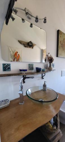a bathroom with a sink and a mirror at Your seaside flat in Porto Santo Stefano