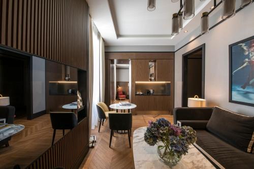 a living room with a couch and a table at Umiltà 36 in Rome